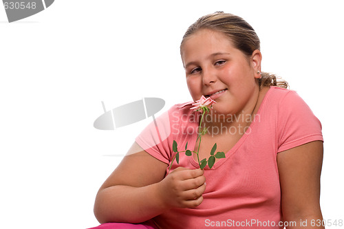 Image of Girl Smelling A Rose