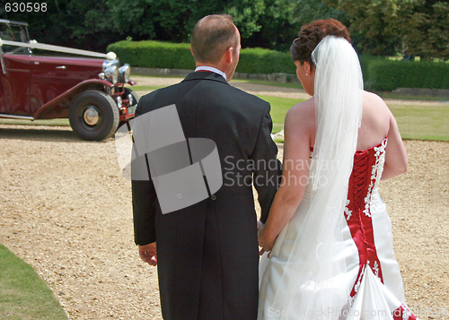 Image of Back of Bride and Groom Walking