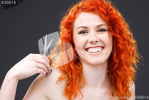 Image of redhead with scissors