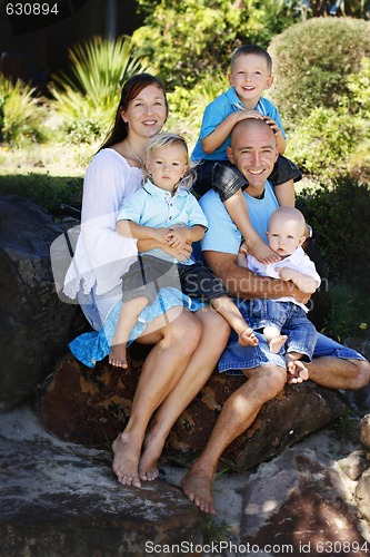 Image of Family enjoying themselves in an outdoor nature setting.