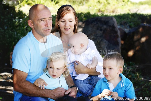 Image of Family enjoying themselves in an outdoor nature setting.