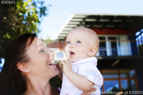 Image of Close-up portrait of a mother and son outdoors.