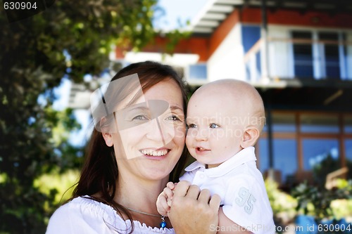 Image of Close-up portrait of a mother and son outdoors.