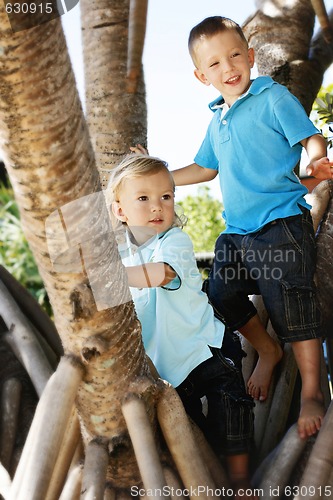 Image of Two happy brothers together outdoors.