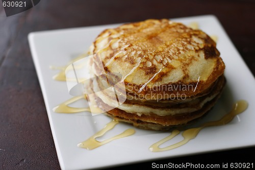 Image of Stack of pancakes with honey.