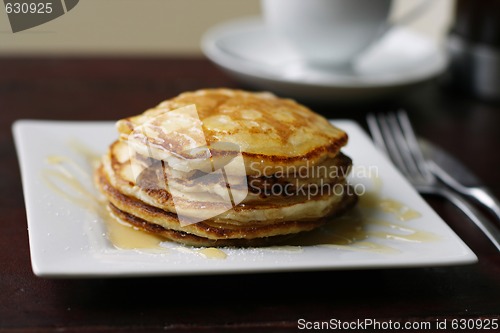 Image of Stack of pancakes and coffee cup.
