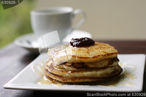 Image of Stack of pancakes and coffee cup.