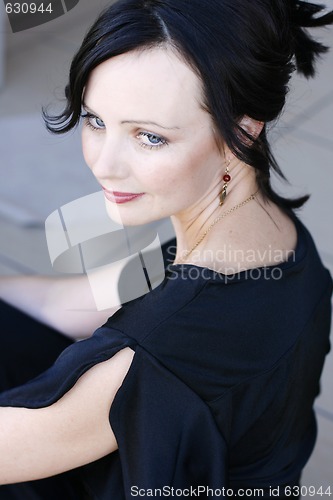 Image of Portrait of a beautiful woman in a black outfit.