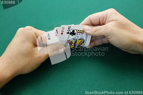 Image of Aces, a two and a king double suited.