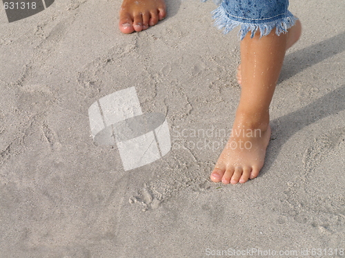 Image of kids feets on sand