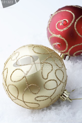Image of Red and gold Christmas bauble decorations.