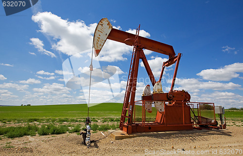 Image of Red pump jack