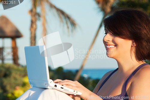 Image of lovely woman with laptop computer