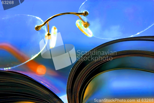 Image of Close up on a pair of Glasses and the Magazine