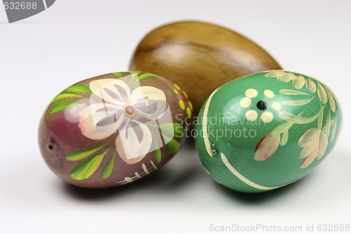 Image of three wooden eggs decorated