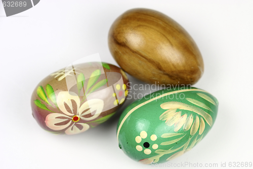Image of three wooden eggs decorated