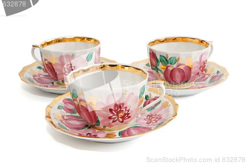 Image of Three tea cups with saucers isolated 