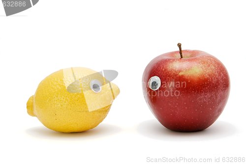 Image of Funny lemon and apple with eyes isolated