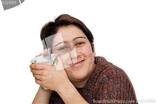 Image of Smiling mid age woman holding a cup isolated
