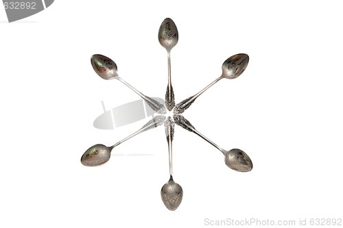 Image of Six-pointed star made of engraved silver spoons isolated