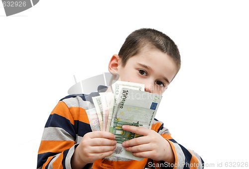 Image of Cute little boy hides behind a fan of banknotes isolated