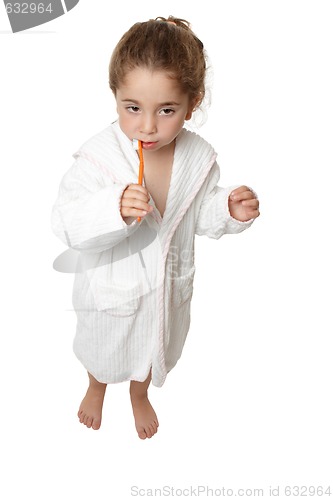 Image of Girl brushing her teeth with toothbrush