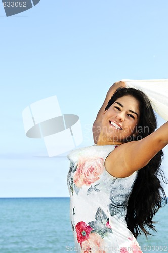 Image of Beautiful young woman at beach