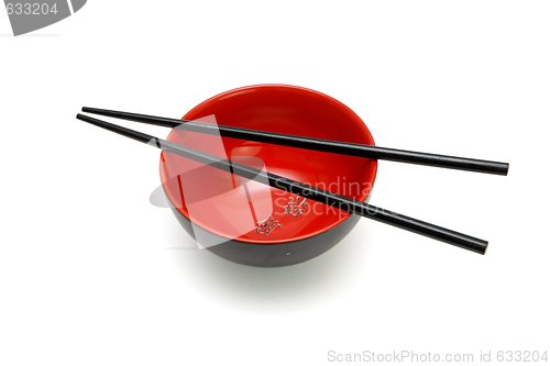 Image of Chopsticks on  red and black bowl with kanji inscription isolated