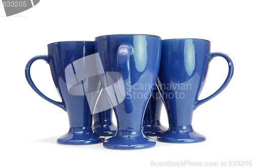 Image of Five blue high coffee cups standing with handles out isolated