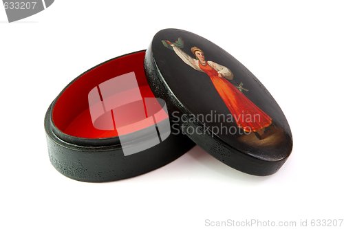 Image of Oval black casket painted with dancing female peasant isolated