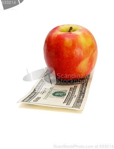 Image of Red apple on twenty dollar bill isolated