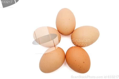 Image of Five-pointed star of five brown eggs isolated