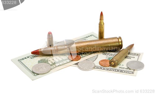 Image of American banknotes, coins and cartridges isolated