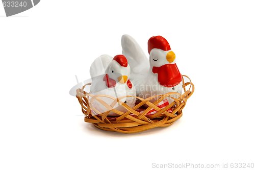 Image of Two porcelain saltsellars in shape of hens in the nest isolated