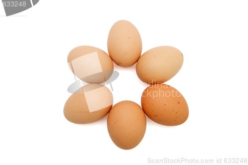 Image of Six-pointed star of six brown eggs isolated