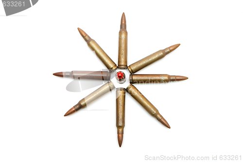 Image of Eight-pointed star made of 5.56mm rifle cartridges isolated