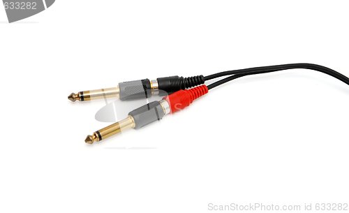Image of Golden headphone plug with black wire isolated 