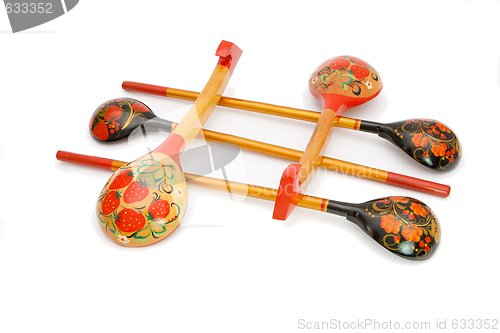 Image of Five Russian wooden painted spoons crossed isolated