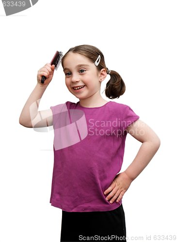 Image of Cute seven years girl with pigtails brush her hair isolated