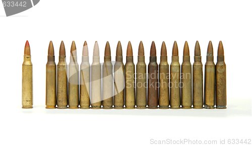 Image of Row of standing 5.56mm rifle cartridges isolated