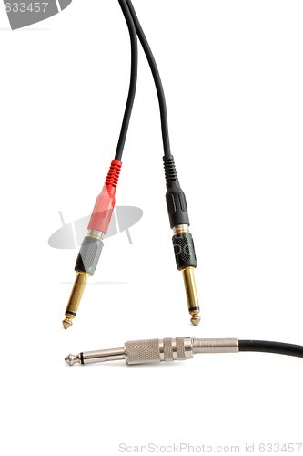 Image of Red, black, silver and golden headphone plugs isolated 