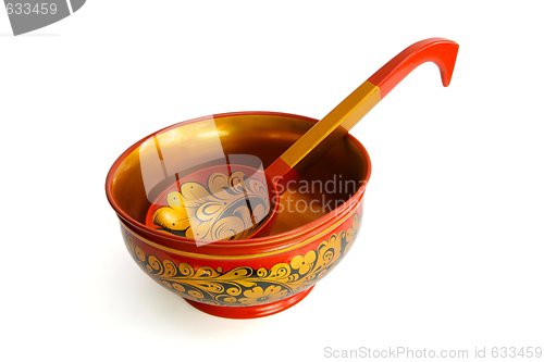 Image of Russian wooden painted bowl with ladle isolated