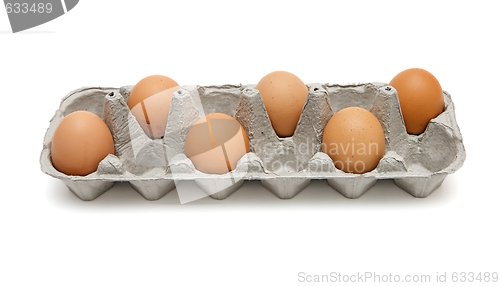 Image of Six brown eggs in a paper box in chess order isolated
