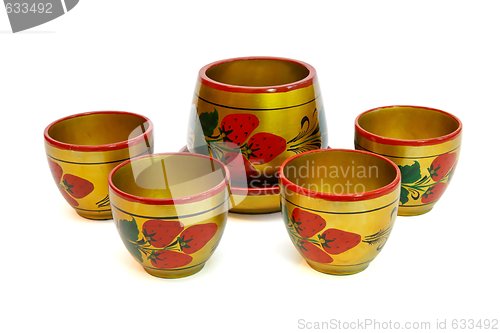 Image of Russian painted wooden honey pot with four cups  isolated