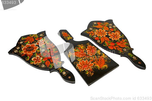 Image of Three Russian black cutting board painted with flowers isolated