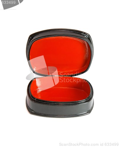 Image of Open oval black casket with red lining isolated