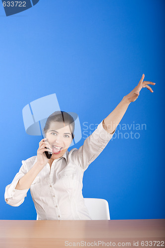 Image of Happy woman calling at phone
