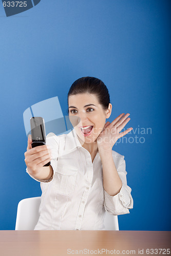 Image of Happy woman calling at phone