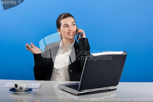 Image of Businesswoman calling at phone