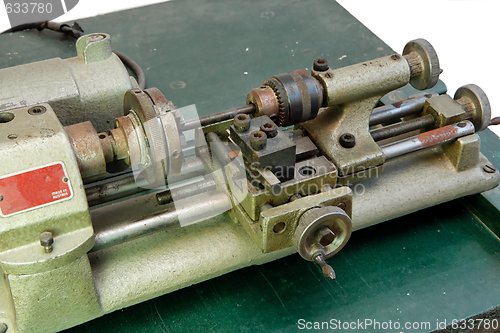 Image of Small metal lathe isolated closeup 